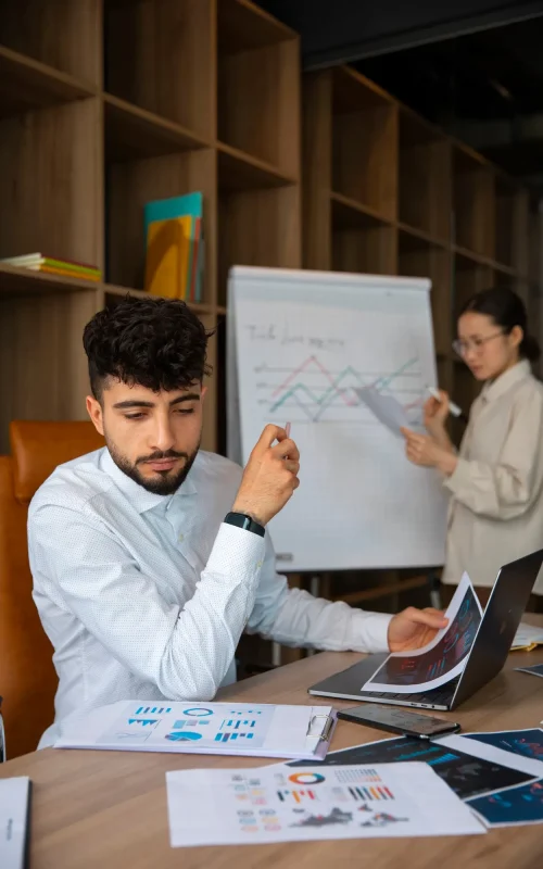 office-workers-using-finance-graphs_23-2150408665