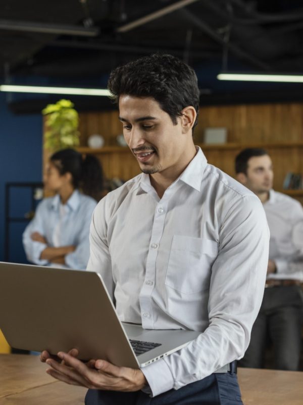 smiley-man-work-holding-laptop (Large)